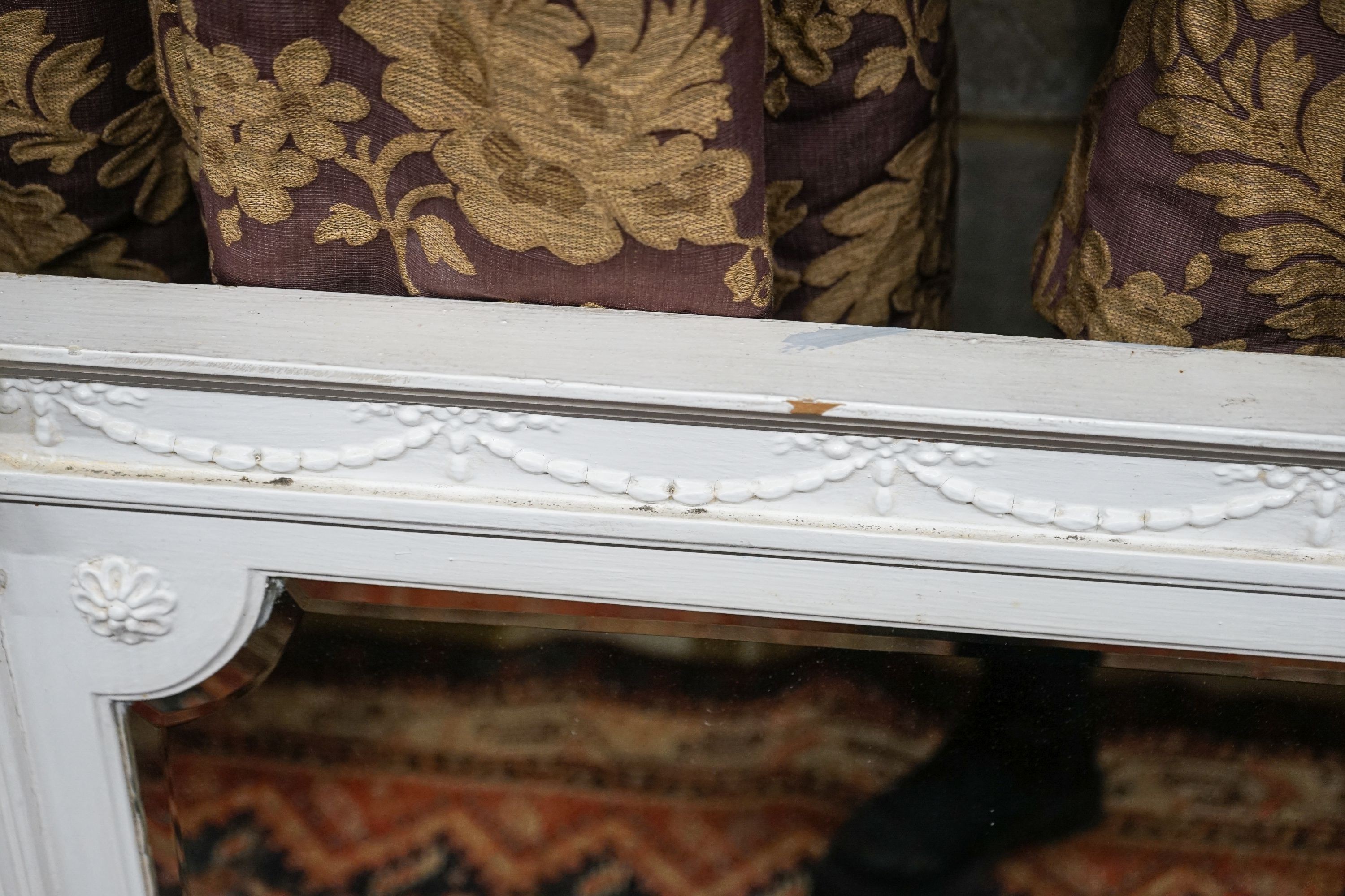 A Victorian later painted overmantel mirror, width 143cm, height 76cm together with a painted and mirrored overmantel